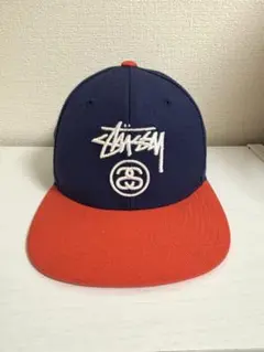 STUSSY スナップバックキャップ ネイビー／オレンジ