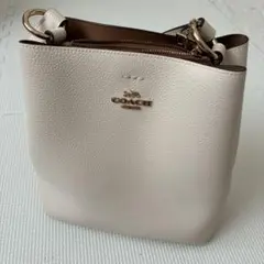 【未使用タグ付】コーチ アクセサリーポーチ バイカラー 型押し チャーム 未使用】コーチ アクセサリーポーチ バイカラー 型押し チャーム付