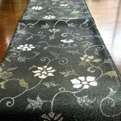 389 【新品未使用】正絹 西陣織 全通柄 袋帯　小花更紗紋様黒地 撚り銀糸