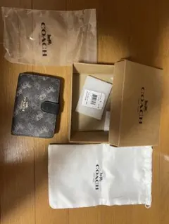 COACH 二つ折り財布 ブラック 馬車プリント