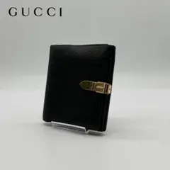 【美品】GUCCI レザー 二つ折り財布 型押し ロゴ プレート ブラック 黒