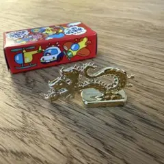 コリスフエラムネ おもちゃ 金メッキ ペラ怪獣 三頭龍 - メルカリ