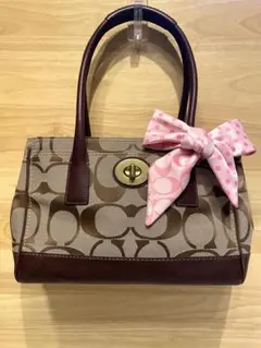 COACH コーチ リボン付き ハンドバッグ トート シグネチャー柄 茶 ピンク