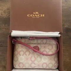 【箱に傷】COACH シグネチャー ポーチ 花柄 ピンク ホワイトのサムネイル