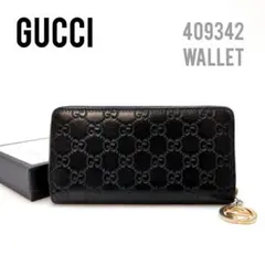 定価11万円　グッチ　ラウンドファスナー　長財布　シマ　本革　エンボス　ブラック