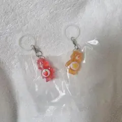 ケアベア クリアマスコットチャーム２ めじるしアクセサリー 赤、黄　2点セット