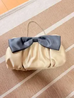 CROLLA リボン付きクラッチバッグ