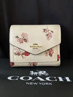 COACH 二つ折り財布 花柄 てんとう虫