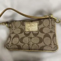 COACH シグネチャー ポーチ ターンロック - メルカリ