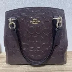 COACH シグネチャー エナメル ハンドバッグ ダークブラウン