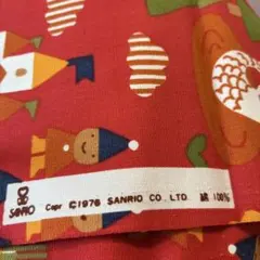 サンリオ　赤い動物とお城のプリント生地