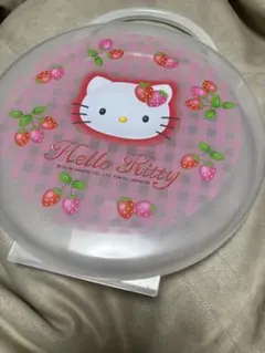 サンリオのハローキティが描かれた持ち手付きの円形ケース