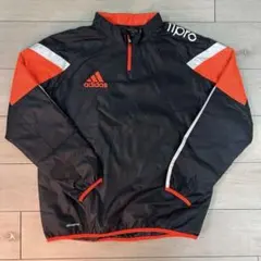 adidas ハーフジップ ピステ・ウィンドブレーカー 黒/オレンジ