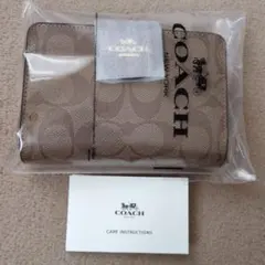 新品 未使用、COACH 二つ折り財布