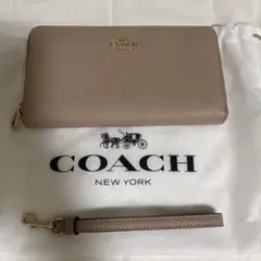 お値下げ COACH ベージュレザー長財布 ストラップ付き