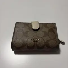 COACH 二つ折り財布 シグネチャー柄