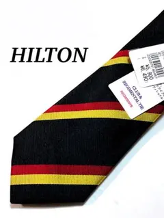 まとめ購入で大幅値引き HILTON レジメンタルストライプ 黒赤黄 ネクタイ