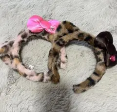 ヒョウ柄リボン付きカチューシャピンク1個