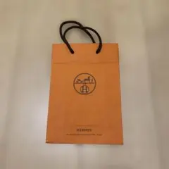 HERMES オレンジ紙袋 黒ロープ持ち手