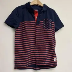 Tommy HLFIGERネイビーと赤のストライプ ポロシャツ