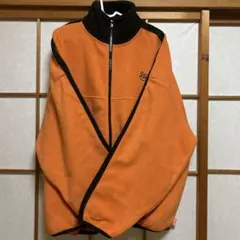 オレンジ フリースジャケット ハイネック