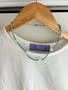 ターコイズブルーとホワイトの花モチーフビーズネックレス