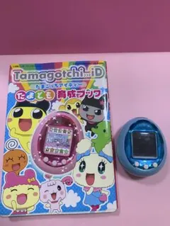 Tamagotchi 紫色 4U 本体と育成ブック - メルカリ