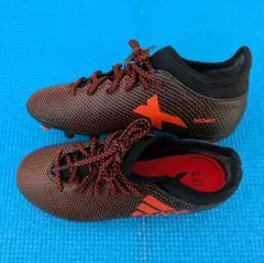 X 173 サッカーシューズ ブラック/オレンジ　21cm