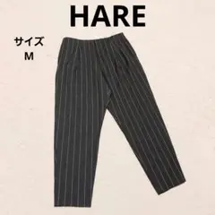 ハレ タックストライプテーパードスラックス M チャコールグレー カジュアル