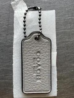 新品未使用品 コーチ レザー キーホルダー チャーム ライトグレー COACH