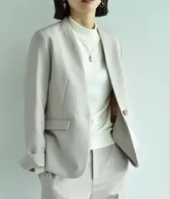 インタープラネット　ベージュ　M ノーカラージャケット ベージュ