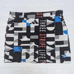 【アディダスゴルフadidas 】スカート インナーパンツ付 黒 青 柄 L
