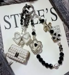 パールバッグチャームりぼん装飾の携帯ストラップ 大人モノトーン好きにも♪