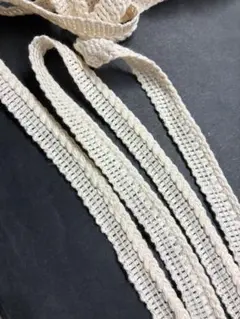 アイボリー コットン 編み込みリボン フリンジ付き