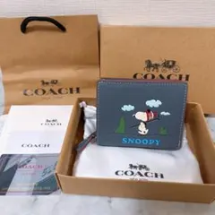 新品COACH コーチ スヌーピー コラボ 二つ折り財布 サーフィン - メルカリ