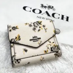 美品✨コーチ　三つ折り財布　フローラル　プリント　総柄　PVC　ホワイト