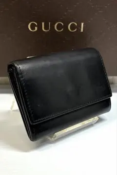 グッチレザー2つ折り 黒 GUCCI グッチ フラップ留め 二つ折り財布 ブラック レザー 101566
