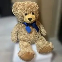 茶色のクマのぬいぐるみ 約30cm 青いリボン付き