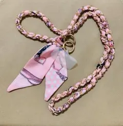 ピンクのリボン付きスマホショルダーストラップ バッグのショルダー