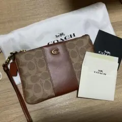 美品✨コーチ シグネチャー ミニポーチ クラッチ 小物入れ Cロゴ ブラウン