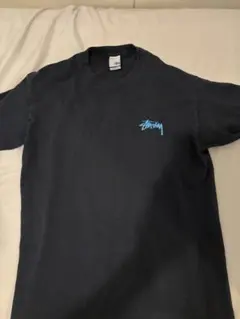 Stussy スカルと花のグラフィック Tシャツ