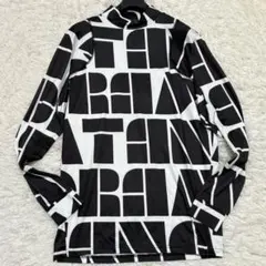 極美品 Lサイズ タングラム デカロゴ 総柄 モックネックシャツ 吸汗速乾のサムネイル