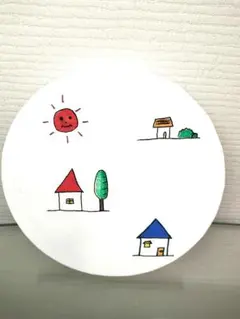 カラフルな家と太陽の絵のボード