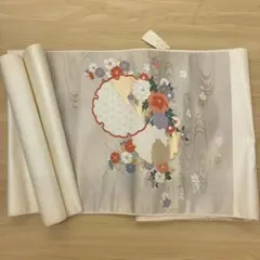 【未使用】正絹 九寸名古屋帯 花丸文 金糸 クリームベージュ 仕立て上がりのサムネイル