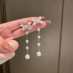 【人気商品】リボンピアス ゴールド 可愛い パール おしゃれ レディース