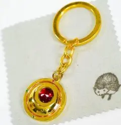 キーホルダー セーラームーン 変身ブローチ　ストラップ 金 円　グッズ【布巾付】