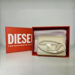 新品 箱付き DIESEL 三つ折り財布 ベージュ ロゴ 1DRのサムネイル