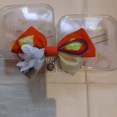 オレンジ色のリボン型髪飾り