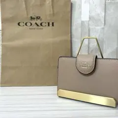 早い者勝ち！訳あり新品 COACH 二つ折り財布 ベージュ系