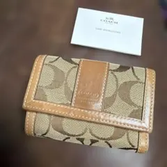COACH 三つ折り財布 シグネチャー柄